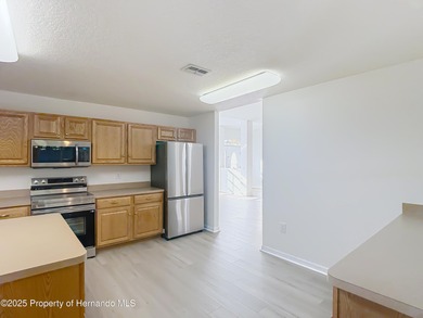 Welcome to this beautifully updated 4-bedroom, 3-bath home on Southern Woods Golf Club in Florida - for sale on GolfHomes.com, golf home, golf lot