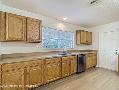 Welcome to this beautifully updated 4-bedroom, 3-bath home on Southern Woods Golf Club in Florida - for sale on GolfHomes.com, golf home, golf lot