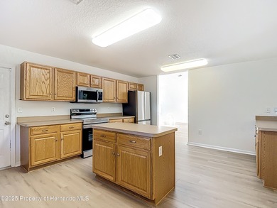 Welcome to this beautifully updated 4-bedroom, 3-bath home on Southern Woods Golf Club in Florida - for sale on GolfHomes.com, golf home, golf lot