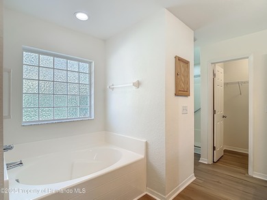 Welcome to this beautifully updated 4-bedroom, 3-bath home on Southern Woods Golf Club in Florida - for sale on GolfHomes.com, golf home, golf lot