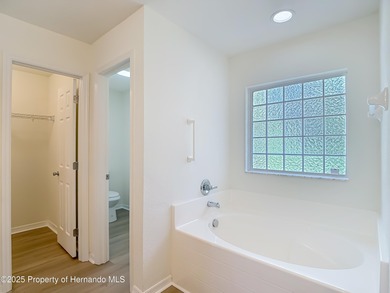 Welcome to this beautifully updated 4-bedroom, 3-bath home on Southern Woods Golf Club in Florida - for sale on GolfHomes.com, golf home, golf lot