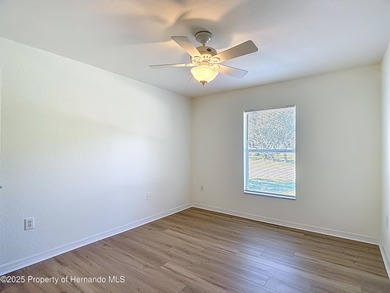 Welcome to this beautifully updated 4-bedroom, 3-bath home on Southern Woods Golf Club in Florida - for sale on GolfHomes.com, golf home, golf lot