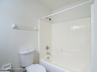 Welcome to this beautifully updated 4-bedroom, 3-bath home on Southern Woods Golf Club in Florida - for sale on GolfHomes.com, golf home, golf lot