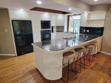 This spacious, nearly 4,700 sq ft house is located in a quiet on Alvamar Orchards in Kansas - for sale on GolfHomes.com, golf home, golf lot