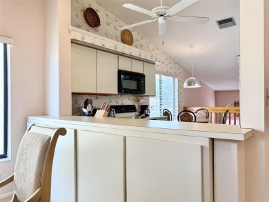 What a Beautiful Lake View this 2-Bedroom, 2-Bathroom Condo has! on Pine Tree Golf Club in Florida - for sale on GolfHomes.com, golf home, golf lot