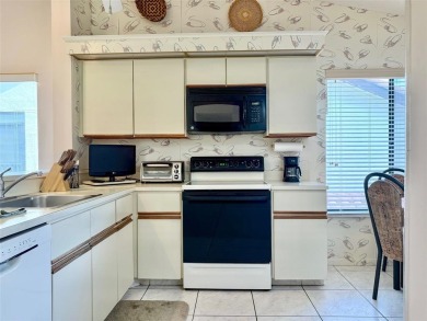 What a Beautiful Lake View this 2-Bedroom, 2-Bathroom Condo has! on Pine Tree Golf Club in Florida - for sale on GolfHomes.com, golf home, golf lot