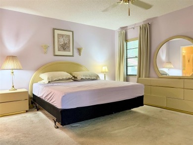 What a Beautiful Lake View this 2-Bedroom, 2-Bathroom Condo has! on Pine Tree Golf Club in Florida - for sale on GolfHomes.com, golf home, golf lot