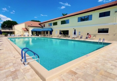 What a Beautiful Lake View this 2-Bedroom, 2-Bathroom Condo has! on Pine Tree Golf Club in Florida - for sale on GolfHomes.com, golf home, golf lot