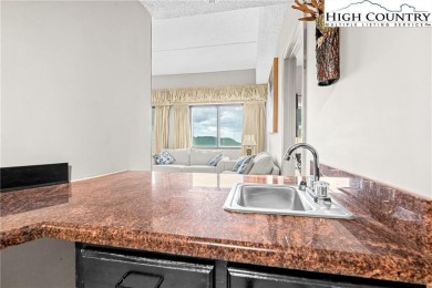 High atop Sugar Mountain, this 2-bedroom, 2-bath condo at on Sugar Mountain Golf Course in North Carolina - for sale on GolfHomes.com, golf home, golf lot