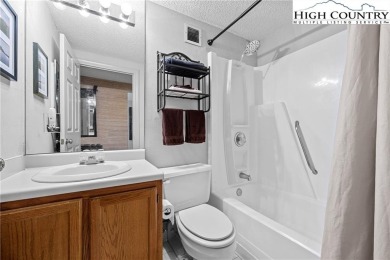 High atop Sugar Mountain, this 2-bedroom, 2-bath condo at on Sugar Mountain Golf Course in North Carolina - for sale on GolfHomes.com, golf home, golf lot