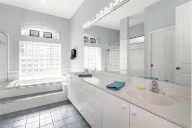 Welcome to this bright and inviting 5-bedroom, 3-bath, and 3-car on Hunters Green Country Club in Florida - for sale on GolfHomes.com, golf home, golf lot