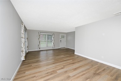 This beautifully designed and updated ranch residence features 2 on Ohio Prestwick Country Club in Ohio - for sale on GolfHomes.com, golf home, golf lot