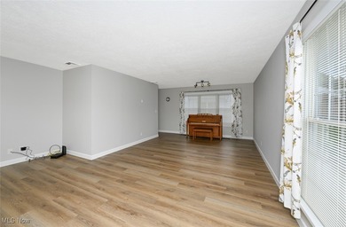 This beautifully designed and updated ranch residence features 2 on Ohio Prestwick Country Club in Ohio - for sale on GolfHomes.com, golf home, golf lot