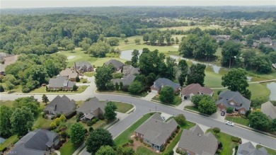 Enter the front door to view the beautiful great room w/stone on Salem Glen Country Club in North Carolina - for sale on GolfHomes.com, golf home, golf lot