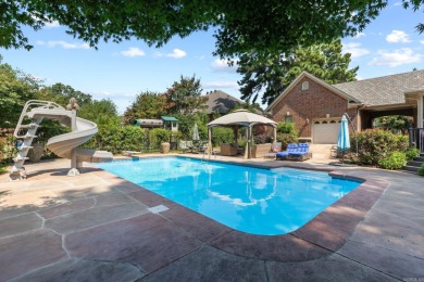 This luxury home w in-ground pool sits on a corner lot alongside on Centennial Valley Golf Course in Arkansas - for sale on GolfHomes.com, golf home, golf lot