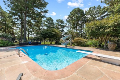 This luxury home w in-ground pool sits on a corner lot alongside on Centennial Valley Golf Course in Arkansas - for sale on GolfHomes.com, golf home, golf lot