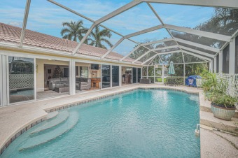 Open up the 40' of privacy impact sliders to bring the out doors on St. Lucie Trail Golf Club in Florida - for sale on GolfHomes.com, golf home, golf lot