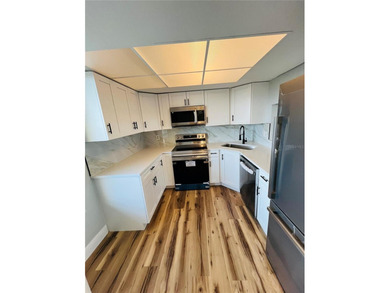 Own this exceptional, fully remodeled 2-bedroom, 2-bathroom on Cove Cay Country Club in Florida - for sale on GolfHomes.com, golf home, golf lot