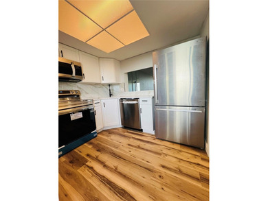 Own this exceptional, fully remodeled 2-bedroom, 2-bathroom on Cove Cay Country Club in Florida - for sale on GolfHomes.com, golf home, golf lot