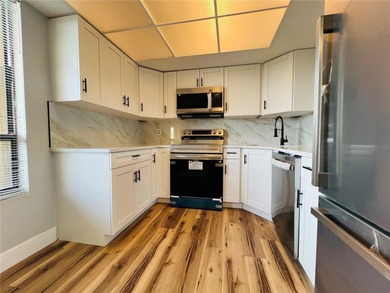 Own this exceptional, fully remodeled 2-bedroom, 2-bathroom on Cove Cay Country Club in Florida - for sale on GolfHomes.com, golf home, golf lot