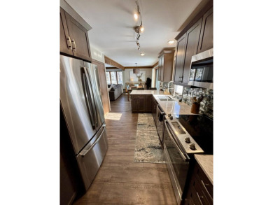 Private northern MI retreat! Renovated 1,428 sq ft chalet on 2 on The Loon Golf Resort in Michigan - for sale on GolfHomes.com, golf home, golf lot