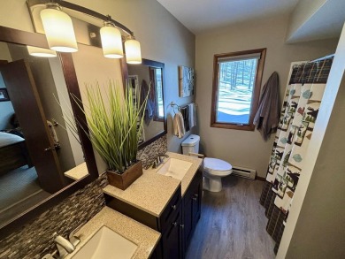 Private northern MI retreat! Renovated 1,428 sq ft chalet on 2 on The Loon Golf Resort in Michigan - for sale on GolfHomes.com, golf home, golf lot