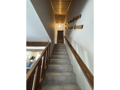 Private northern MI retreat! Renovated 1,428 sq ft chalet on 2 on The Loon Golf Resort in Michigan - for sale on GolfHomes.com, golf home, golf lot