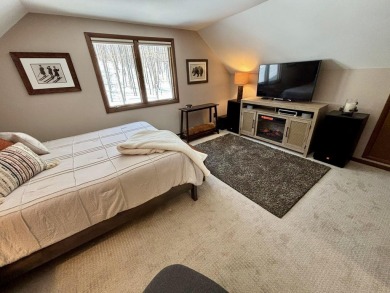 Private northern MI retreat! Renovated 1,428 sq ft chalet on 2 on The Loon Golf Resort in Michigan - for sale on GolfHomes.com, golf home, golf lot