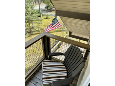 Private northern MI retreat! Renovated 1,428 sq ft chalet on 2 on The Loon Golf Resort in Michigan - for sale on GolfHomes.com, golf home, golf lot