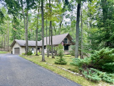 Private northern MI retreat! Renovated 1,428 sq ft chalet on 2 on The Loon Golf Resort in Michigan - for sale on GolfHomes.com, golf home, golf lot