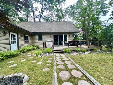 Private northern MI retreat! Renovated 1,428 sq ft chalet on 2 on The Loon Golf Resort in Michigan - for sale on GolfHomes.com, golf home, golf lot