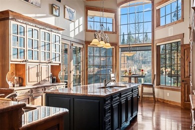 2140 Hunters Knob Road blends timeless masonry, elegant finishes on Raven Golf Club At Three Peaks in Colorado - for sale on GolfHomes.com, golf home, golf lot