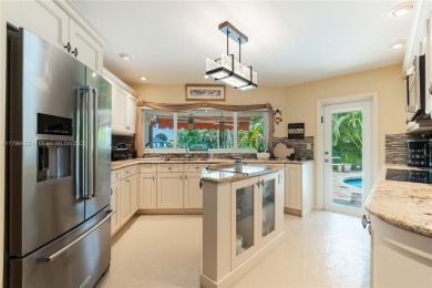Welcome to this stunning 4 bed, 2.5-bath lakefront home located on Jacaranda Golf Club in Florida - for sale on GolfHomes.com, golf home, golf lot