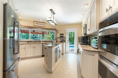 Welcome to this stunning 4 bed, 2.5-bath lakefront home located on Jacaranda Golf Club in Florida - for sale on GolfHomes.com, golf home, golf lot
