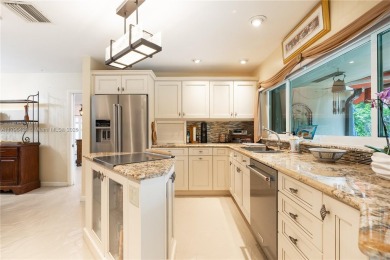 Welcome to this stunning 4 bed, 2.5-bath lakefront home located on Jacaranda Golf Club in Florida - for sale on GolfHomes.com, golf home, golf lot