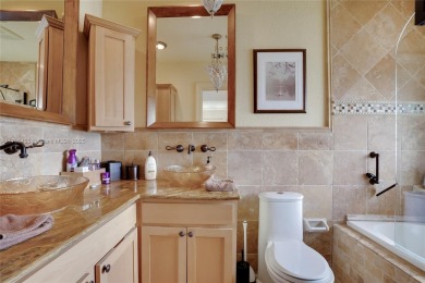 Welcome to this stunning 4 bed, 2.5-bath lakefront home located on Jacaranda Golf Club in Florida - for sale on GolfHomes.com, golf home, golf lot