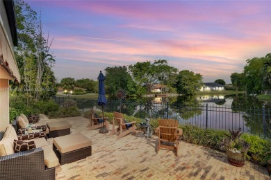 Welcome to this stunning 4 bed, 2.5-bath lakefront home located on Jacaranda Golf Club in Florida - for sale on GolfHomes.com, golf home, golf lot