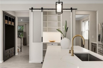 Discover refined luxury within the contemporary ambiance of this on Old Corkscrew Golf Club in Florida - for sale on GolfHomes.com, golf home, golf lot