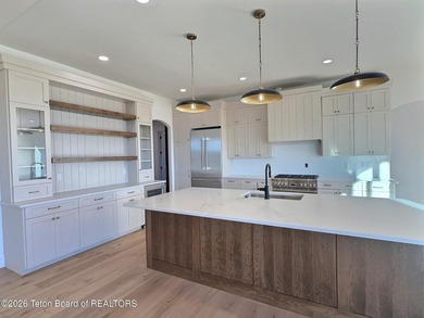 This home perfectly blends luxury with practicality. It offers a on Teton Reserve in Idaho - for sale on GolfHomes.com, golf home, golf lot