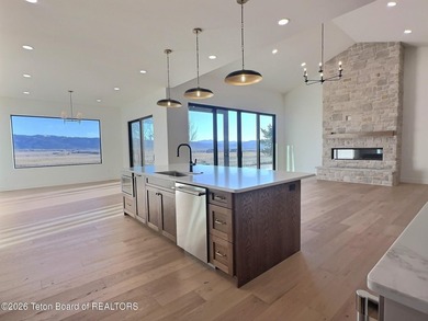 This home perfectly blends luxury with practicality. It offers a on Teton Reserve in Idaho - for sale on GolfHomes.com, golf home, golf lot