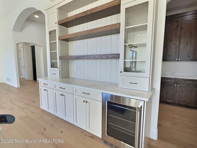 This home perfectly blends luxury with practicality. It offers a on Teton Reserve in Idaho - for sale on GolfHomes.com, golf home, golf lot