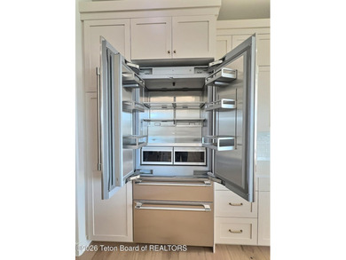 This home perfectly blends luxury with practicality. It offers a on Teton Reserve in Idaho - for sale on GolfHomes.com, golf home, golf lot