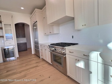 This home perfectly blends luxury with practicality. It offers a on Teton Reserve in Idaho - for sale on GolfHomes.com, golf home, golf lot