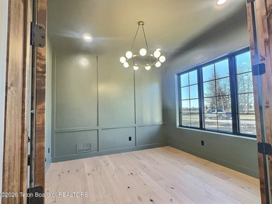 This home perfectly blends luxury with practicality. It offers a on Teton Reserve in Idaho - for sale on GolfHomes.com, golf home, golf lot