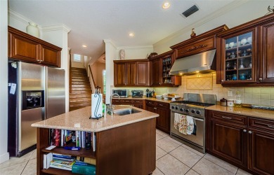 Welcome to this beautifully appointed 5-bedroom, 4-bathroom on Wentworth Golf Club in Florida - for sale on GolfHomes.com, golf home, golf lot