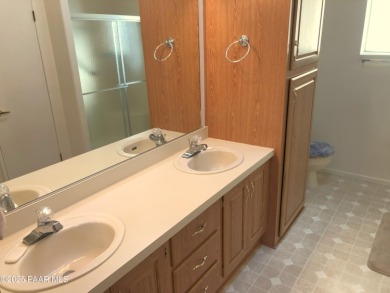 Fabulous home at a fabulous price! Long time owners have taken on Quail Wood Greens Golf Course in Arizona - for sale on GolfHomes.com, golf home, golf lot