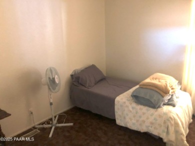 Fabulous home at a fabulous price! Long time owners have taken on Quail Wood Greens Golf Course in Arizona - for sale on GolfHomes.com, golf home, golf lot