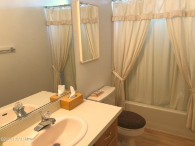 Fabulous home at a fabulous price! Long time owners have taken on Quail Wood Greens Golf Course in Arizona - for sale on GolfHomes.com, golf home, golf lot