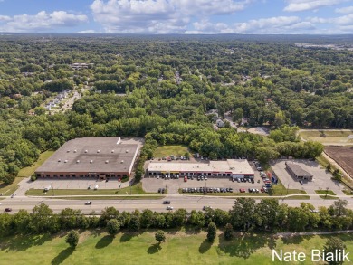 Great opportunity for a fully leased automotive retail Grand on Indian Trails Golf Course in Michigan - for sale on GolfHomes.com, golf home, golf lot