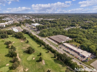 Great opportunity for a fully leased automotive retail Grand on Indian Trails Golf Course in Michigan - for sale on GolfHomes.com, golf home, golf lot